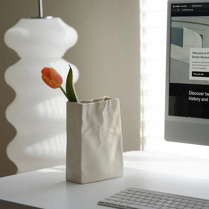 Elegant Ceramic Vase with Textured Paper Bag Design