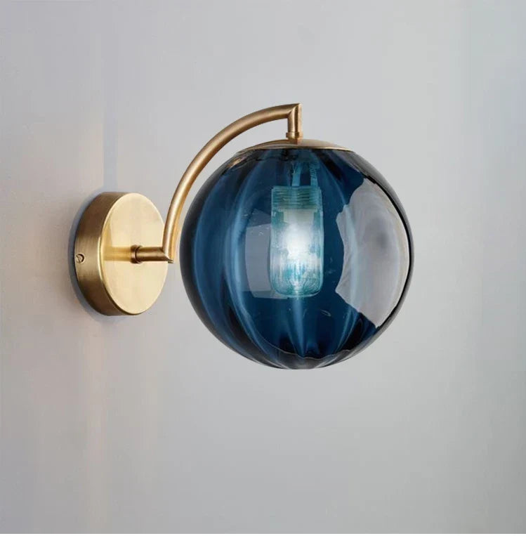 Sleek Wall Light with Glass Globe & Elegant Brass Touches