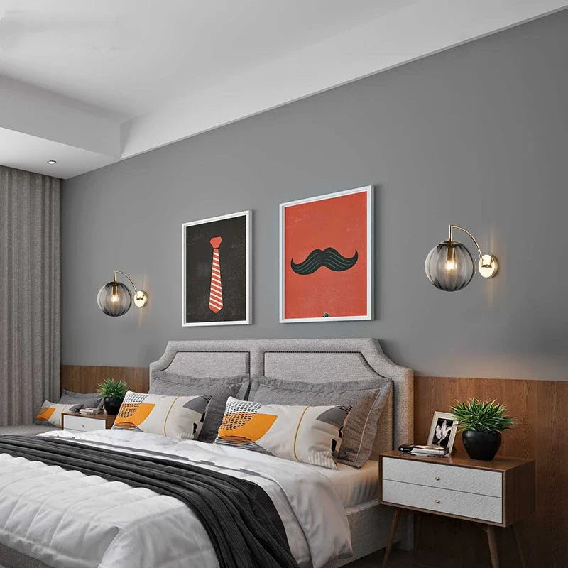 Sleek Wall Light with Glass Globe & Elegant Brass Touches