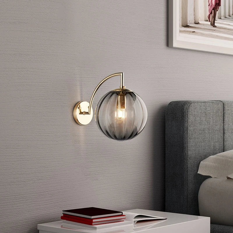Sleek Wall Light with Glass Globe & Elegant Brass Touches