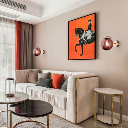 Sleek Wall Light with Glass Globe & Elegant Brass Touches