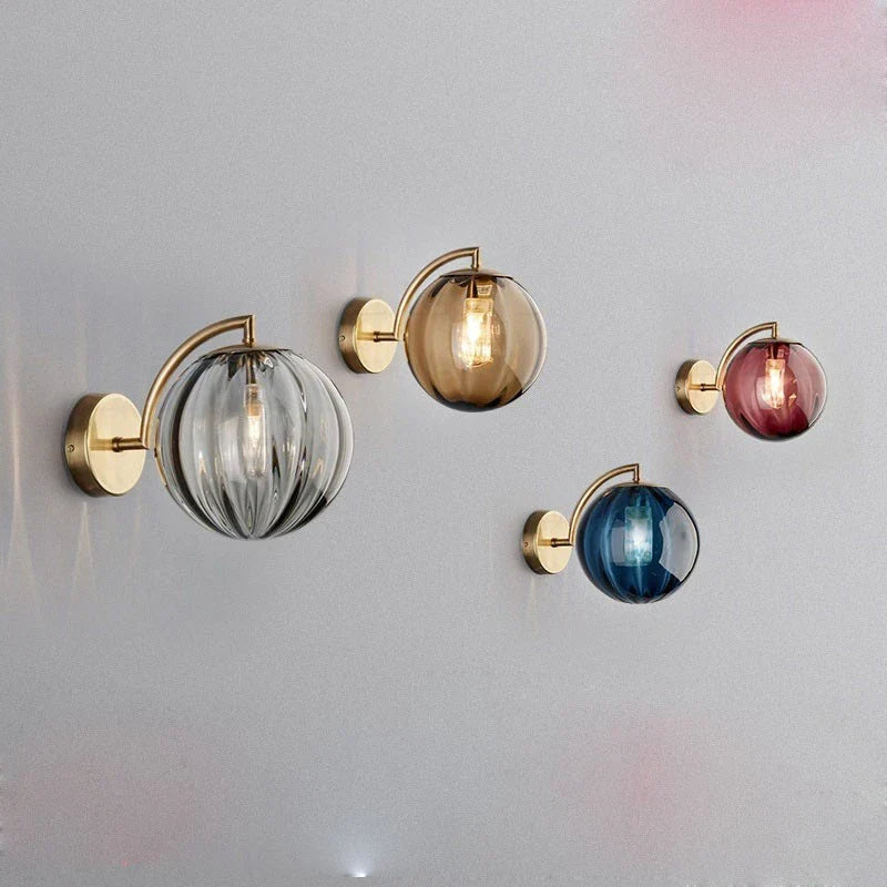Sleek Wall Light with Glass Globe & Elegant Brass Touches